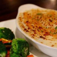 Shepherd'S Pie · Prime ground beef, onions, carrots and peas smothered in rich brown gravy and topped with ma...