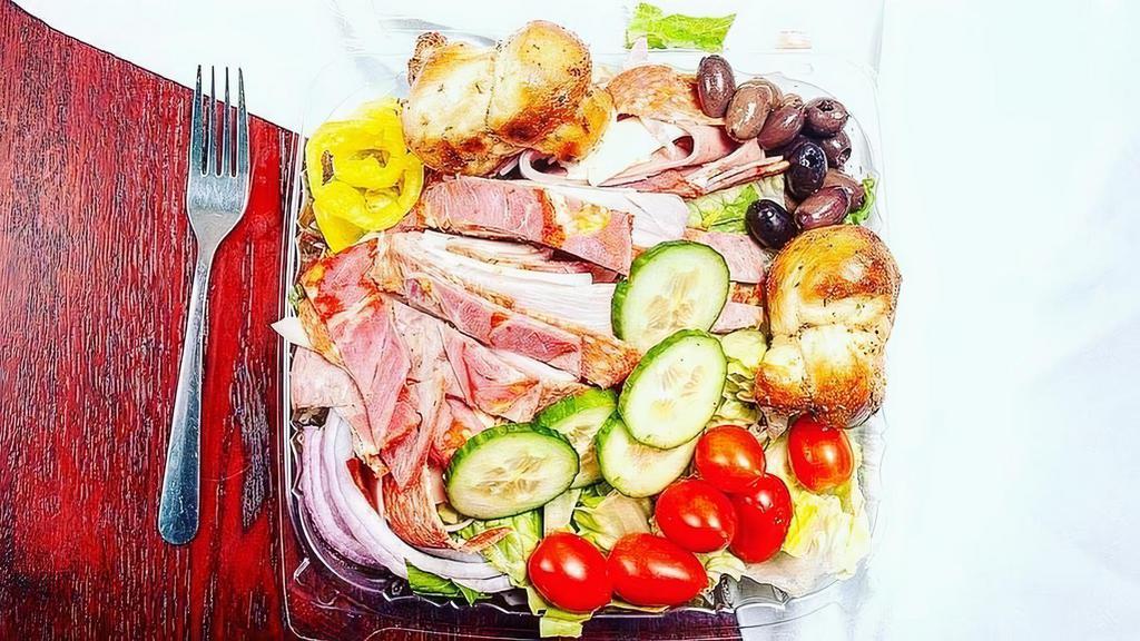 Antipasto Salad · Our garden salad topped with Italian cold cuts and sharp provolone cheese.