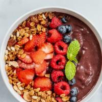 Berry Acai Bowl · Acai topped with strawberries, blueberries, house berry jam, and granola.