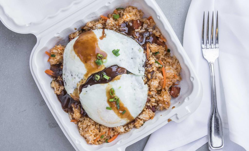 Hilo Style Loco Moco · Hamburger patty over our spicy fried rice.
Gravy
Topped with two eggs (over medium)