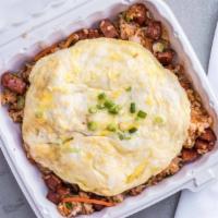 Spicy Fried Rice · Portuguese sausage, green onions and carrots, topped with egg.