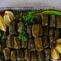 Dolmades · Vegetarian. Vegan. Stuffed greek grape leaves with rice, herbs, and lemon.