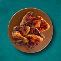 Bone-In Wing   (10 Pcs) · Enjoy our juicy traditional wings in your choice of preparatory sauce and an optional dippin...