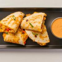 Teriyaki Quesadilla · NEW! Mixture of cheeses, teriyaki chicken and roasted peppers in a grilled flour tortilla, s...