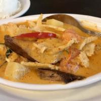 Red Curry · Medium Spicy. Red curry with bamboo shoots and eggplants topped with basil leaves.