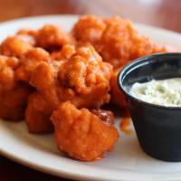 Buffalo Cauliflower Bites · Tasty and full of buffalo chicken wing goodness. Deep fried cauliflower florets smothered in...