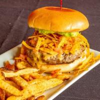Nacho Momma’S Burger · 8 oz all beef patty topped with queso, tortilla strips, guacamole and pico. Served with your...