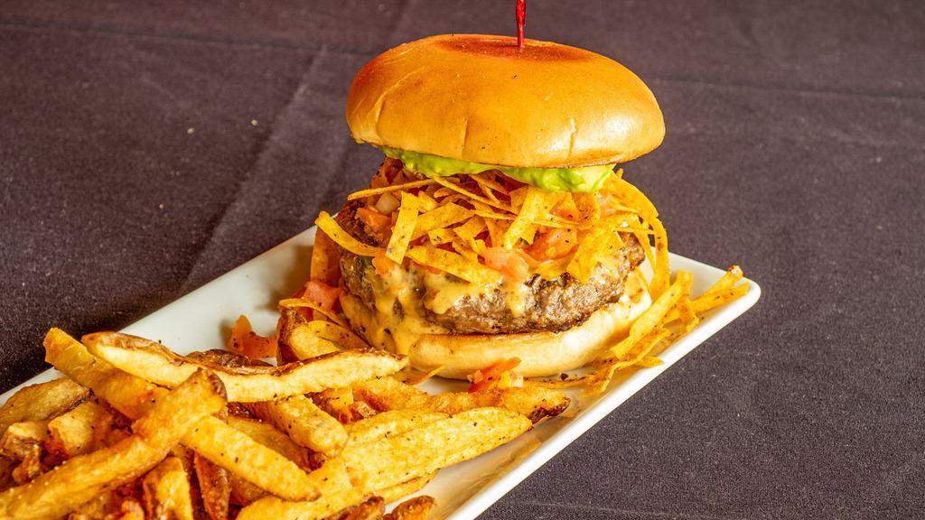 Nacho Momma’S Burger · 8 oz all beef patty topped with queso, tortilla strips, guacamole and pico. Served with your choice of side.