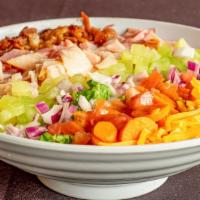 Chef Salad · Chopped green leaf lettuce topped with ham, turkey, bacon, mixed cheese, carrots, onion and ...