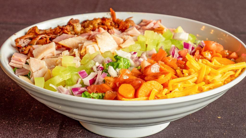 Chef Salad · Chopped green leaf lettuce topped with ham, turkey, bacon, mixed cheese, carrots, onion and tomato. Served with your choice of homemade honey mustard, blue cheese, ranch, or Italian dressing.