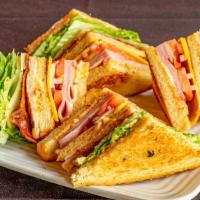 The Dagwood Club · Smoked ham and turkey, American cheese, house-spiced bacon, lettuce, tomato and red onion wi...