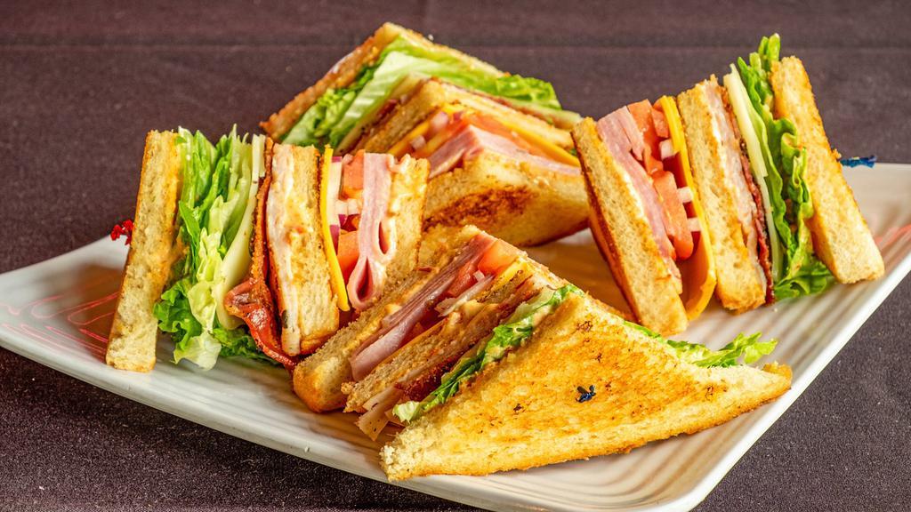 The Dagwood Club · Smoked ham and turkey, American cheese, house-spiced bacon, lettuce, tomato and red onion with Fresno aioli on toasted sourdough.