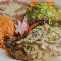 Carne Asada Con Rajas Y Creama · Marinated steak grilled to taste with strips OC chile poblano, onion in a cream, garlic and ...