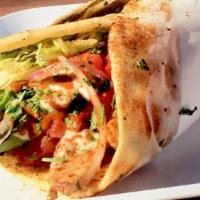 Chicken Kebab · Roasted chicken w/ lettuce, tomatoes, onions,
tzatziki sauce, spicy red sauce, wrapped in pi...