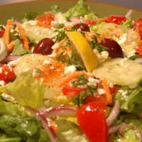 Turk Salad · Big helping of fresh cut green leaf w/ hummus, carrots, tomatoes, red onions, cucumbers, oli...