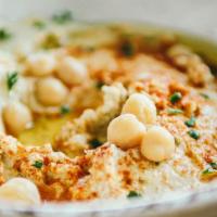 Hummus & Pita · Large scoop (4 oz.) of humus, olive oil, zatar spices on pita, paprika, olives, cucumbers (a...
