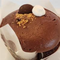 S'Mores · Chocolate cake, graham cracker crust, filled with marshmallow and topped with chocolate fros...