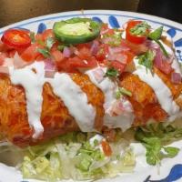The Dinner Burrito · choice of protein | mexican rice | pinto beans | queso |  crema | pico de gallo | fresh jala...