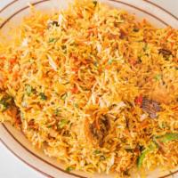 Chicken Biryani · Biryanis are cooked with basmati rice with whole spices nuts and finished with saffron.