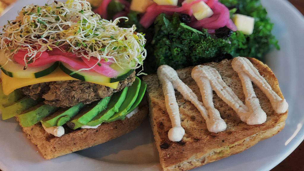 Lentil Burger (Gf) · Gluten Free. Housemade gluten free lentil potato patty, chao ‘cheese’, avocado, tahini, cucumbers, pickled onions, sprouts on Nuflours gluten free bread.
