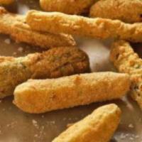 Fried Dill Pickles · Tangy dill pickle slice with our special seasoning with dale's horseradish sauce.