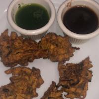Vegetable Pakora · Deep-fried fritter made of vegetables dipped in a chickpea batter.