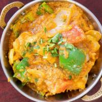 Chicken Karahi · Chicken cooked with onion, tomatoes, ginger & bell peppers in Indian spices.