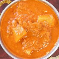Lamb Vindaloo (Spicy) · Lamb simmered with potatoes in a tangy hot sauce.