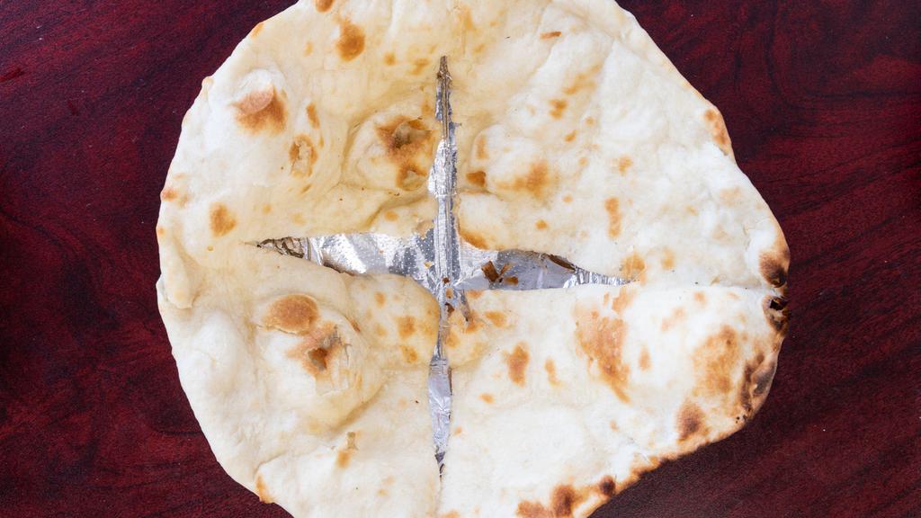 Butter Naan · White flour bread baked in our clay oven.