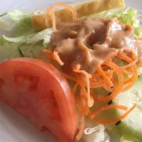 Vegetable Thai Salad
 · Lettuce, tomatoes, carrot, onion, cucumber, and fried tofu topped with peanut dressing.