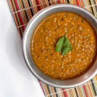Dal Makhani · Traditional Indian urad lentils, enhanced with onions, tomatoes and spices.