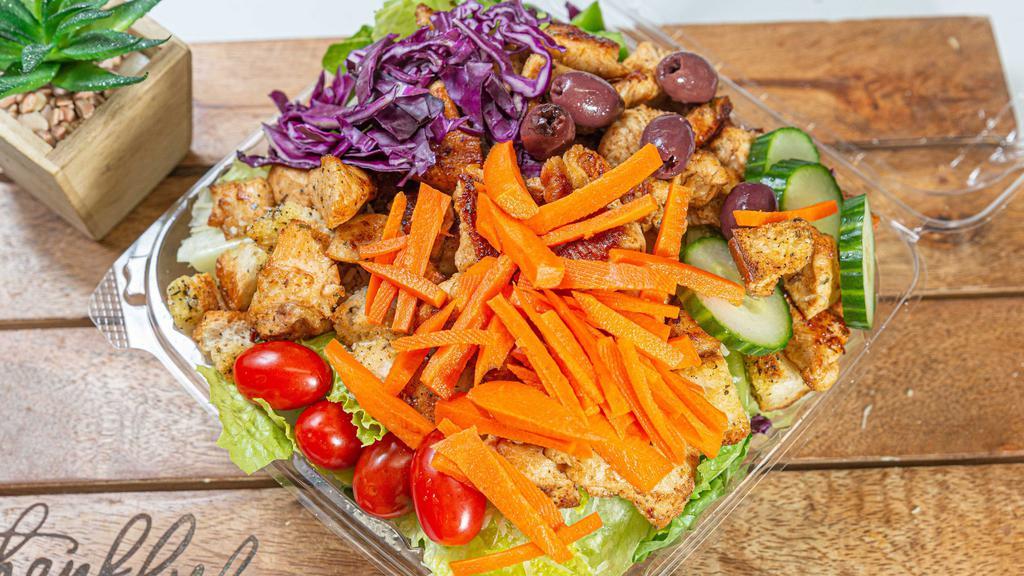 Grilled Chicken Garden Salad · Romaine lettuce, tomatoes, green peppers, red cabbage, cucumbers, carrots, olives and pepperoncini, topped with grilled chicken breast.