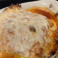 Lasagna · Thick layers of pasta, sausage, onions and a rich mozzarella cheese baked to perfection in B...