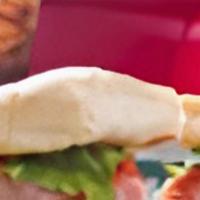 Hot Ham & Cheese · Slices of lean ham and melted mozzarella cheese, lettuce, onion and Bearno’s tomato sauce pi...