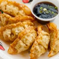 Thai Dumpling (Six Pieces) · Homemade fried chicken dumpling with a sweet soy sauce.