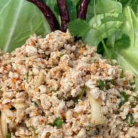 Larb Kai · Spicy minced chicken salad, shallot, scallions, cilantro, mint, roasted rice and lime juice....