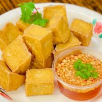 Age Tofu · Crispy fried tofu, served with sweet chili sauce.