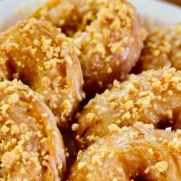 Thai Donut (Five Pieces) · Fried donuts coated with condensed milk sprinkled with crushed peanuts.