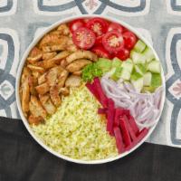 Chicken Shawarma Bowl · Chicken shawarma, rice, lettuce, tomatoes, pickles, garlic paste, Tahini, & bread