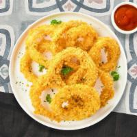 Onion Rings · Sliced onions dipped in a light batter and fried until crispy and golden brown.