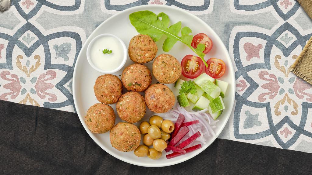 Falafel Side · Baked and fried mixture of garbanzo beans, fava beans, coriander, cumin, parsley and onions.