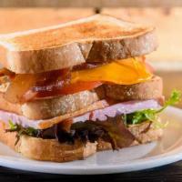 Club Sandwich · Smoked turkey and ham, lettuce, tomato, cheddar cheese and bacon