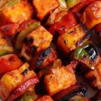 Paneer Kabob · Paneer marinated in Tikka spices, grilled in Tandoor oven with bell peppers and onions. Serv...