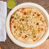 Garlic Naan · Authentic soft buttery bread made fresh per order in our traditional oven topped with butter...