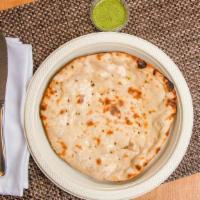 Butter Naan · Authentic soft buttery bread made fresh per order in our traditional oven topped with butter.