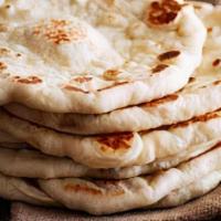 Plain Naan · Authentic soft buttery bread made fresh per order in our traditional oven.
