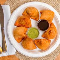 Vegetable Samosa · Vegetable and potato stuffing in the battered dough for a crispy and crunchy bite.