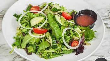 Simple Salad · Mixed greens, chopped iceberg, grape tomatoes, cucumbers, chives, and red wine vinaigrette.