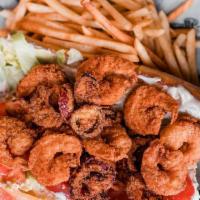 B&T Po’Boy Sandwich · Fried shrimp, hot cherry peppers, cajun, remoulade, and torpedo roll. Served with fries or h...