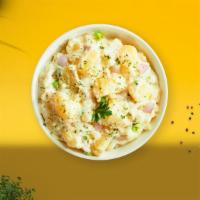 Merry Mashed Potatoes · (Vegetarian) Mashed Idaho potatoes cooked, seasoned with garlic, butter, and topped with cri...
